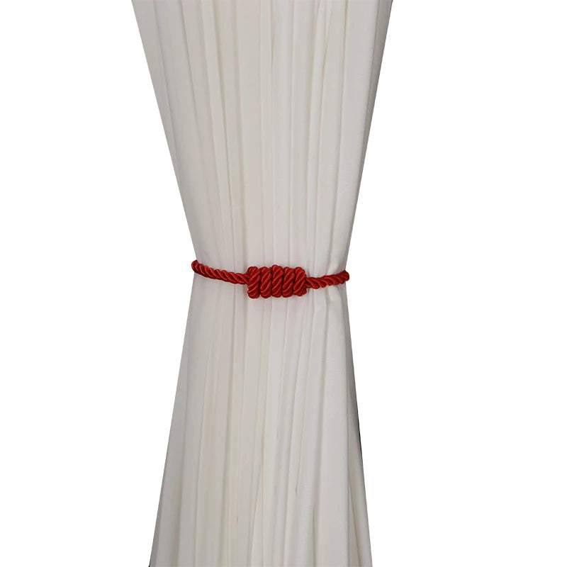 "bracelet tressé rouge original et robuste" (which means "unique twisted red rope bracelet and sturdy") could be a good short and simple keyword for this image. it highlights both the unconventional appearance and the red color of the bracelet, while also emphasizing its robustness thanks to the twisted rope design.