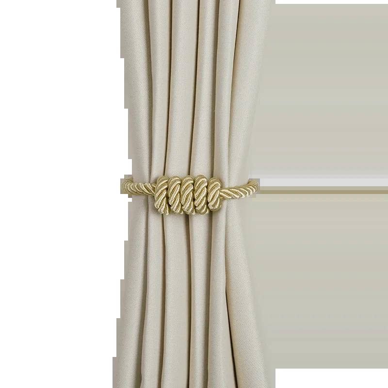 "corde beige avec perles argentées scintillantes" (beige rope with sparkling silver beads) could be a simple and concise keyword for this image. it highlights the main features of the object and gives a sense of its appearance.